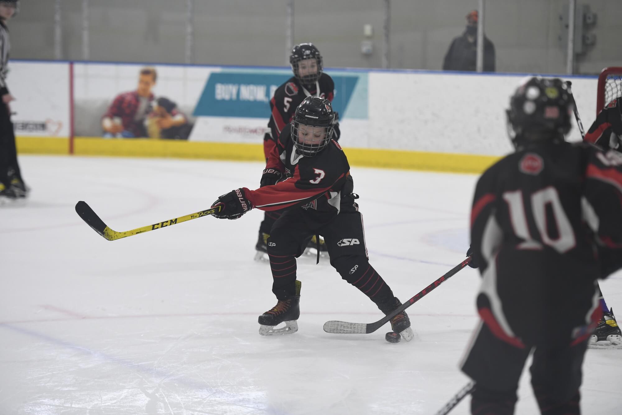 Kid's playing hockey in Regina at the REAL District