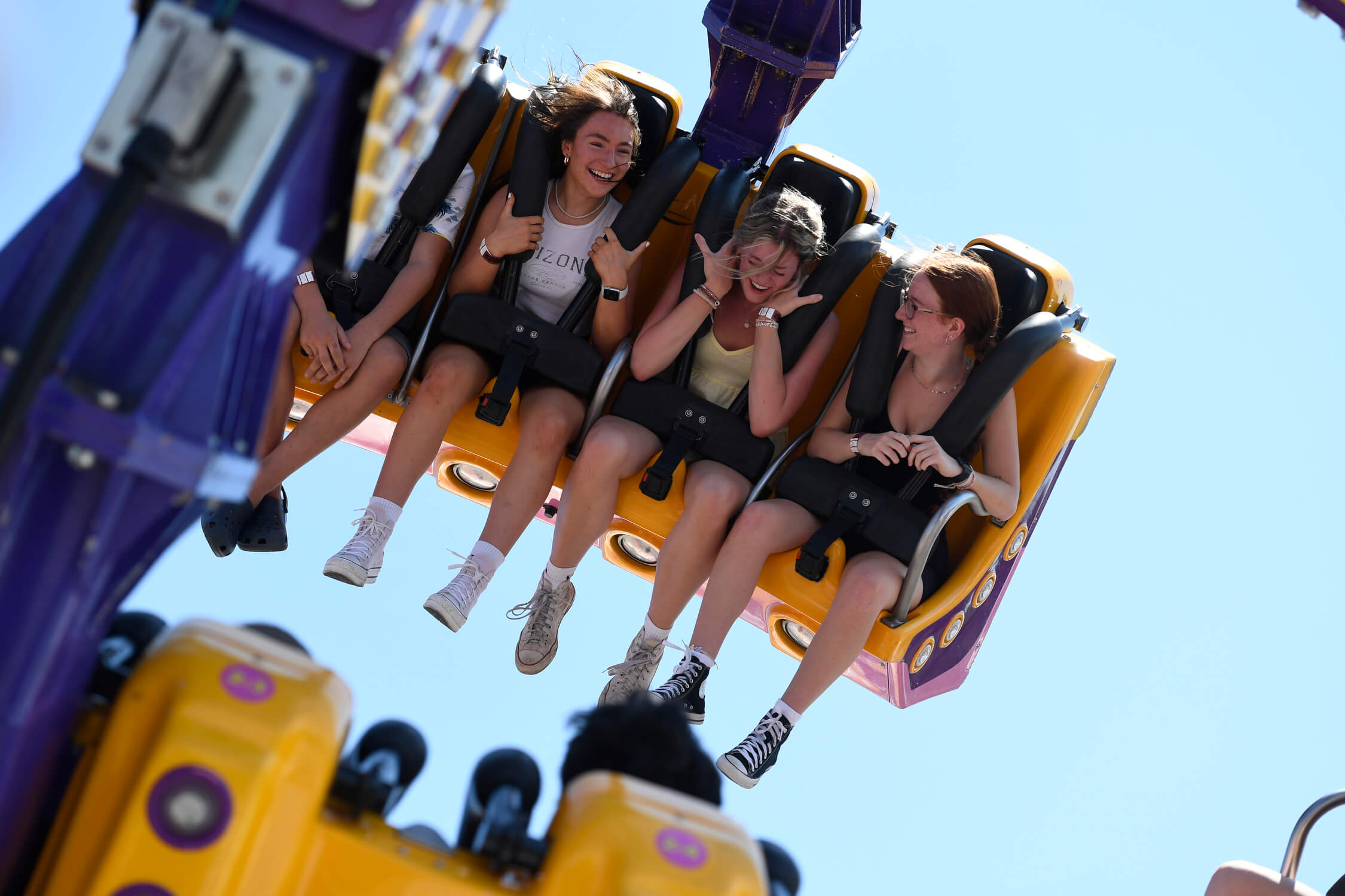 Friends on a thrill ride on the Queen City Ex midway, Regina, SK