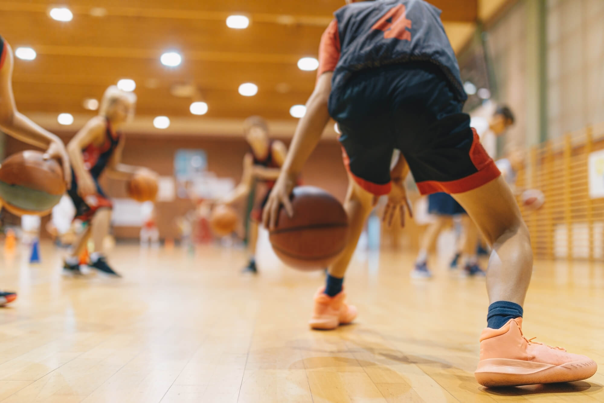 Teens playing basketball - stock photo