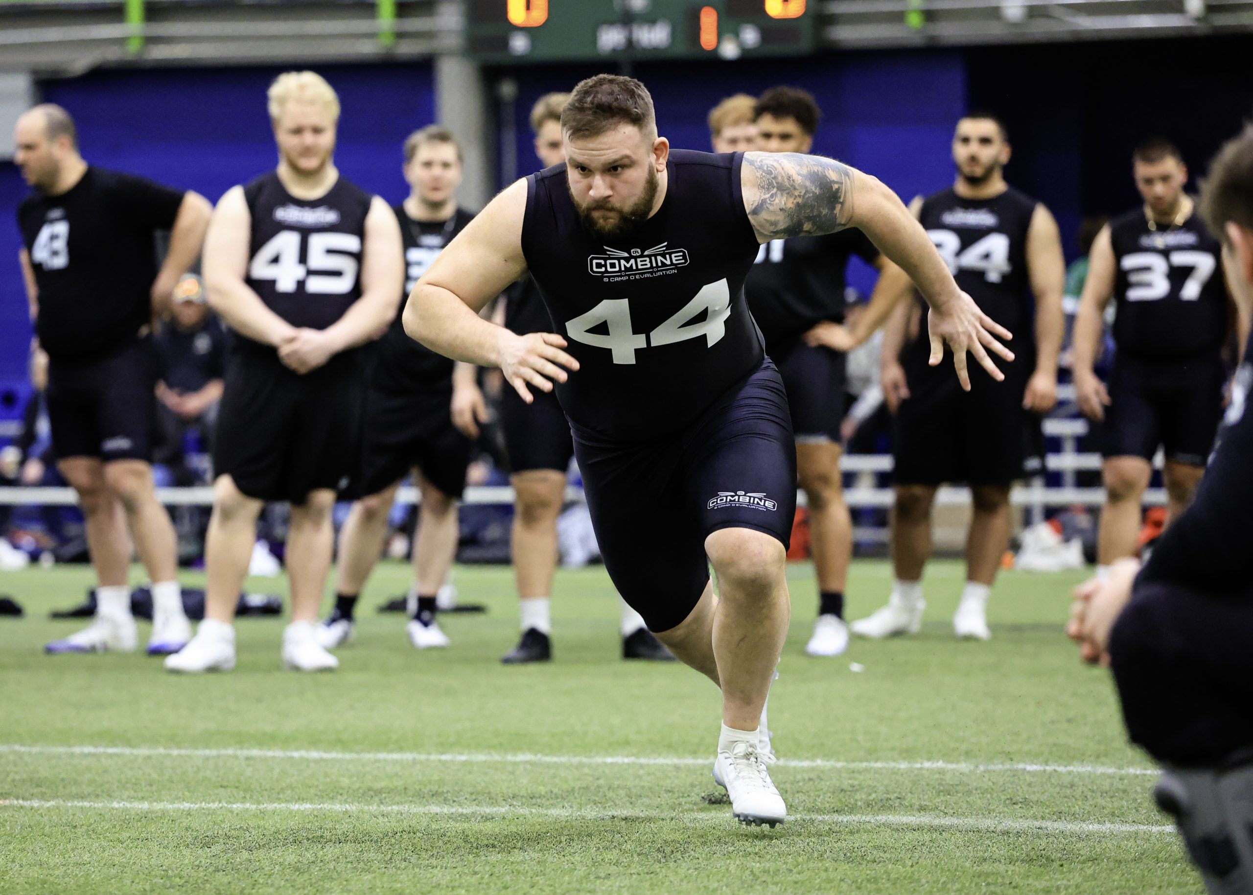 Athlete sprinting at football combine event