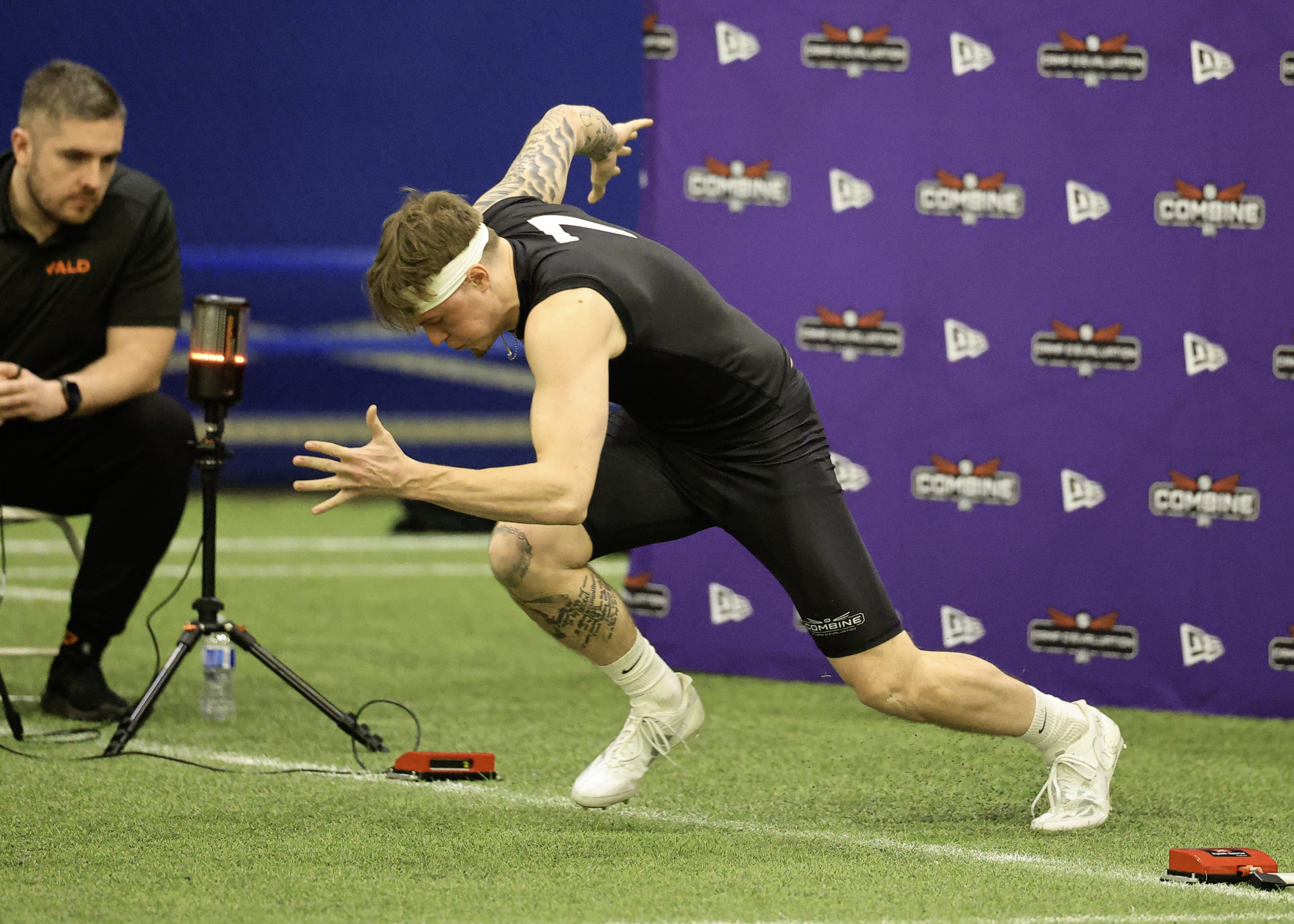 Athlete starting sprint at sports combine event.